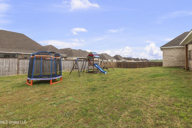 970 Glenwild Cir, Canton, MS 39046 - view of yard featuring a trampoline and a playground