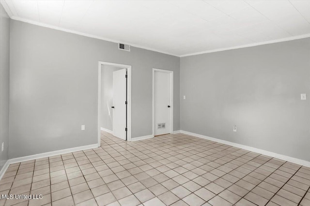 unfurnished room with crown molding