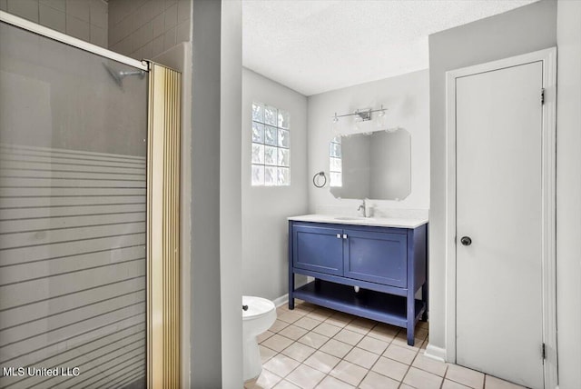 bathroom with a shower with shower door, tile patterned flooring, vanity, toilet, and a textured ceiling