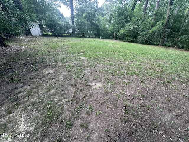 558 Daniel Cir, Jackson, MS 39212 - view of yard featuring a forest view
