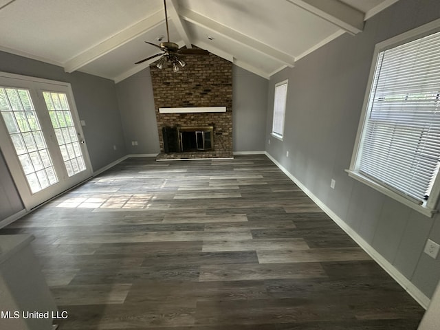 558 Daniel Cir, Jackson, MS 39212 - unfurnished living room with ceiling fan, wood finished floors, a fireplace, and baseboards