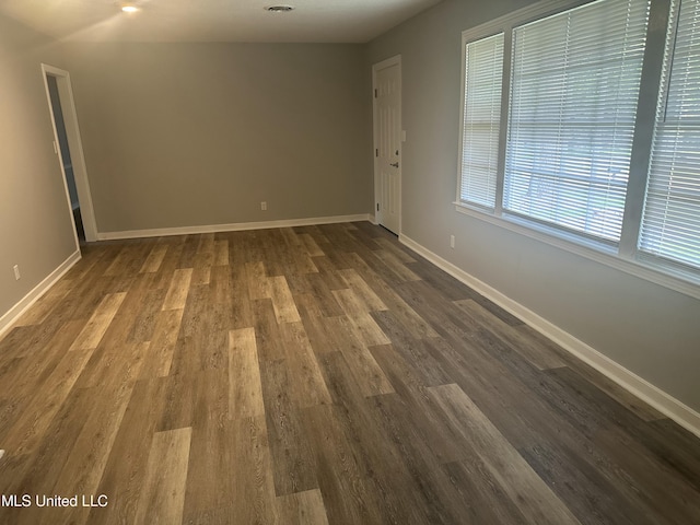 558 Daniel Cir, Jackson, MS 39212 - unfurnished room with dark wood-type flooring and baseboards
