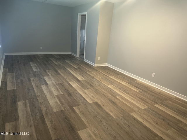 558 Daniel Cir, Jackson, MS 39212 - empty room with dark wood-style flooring and baseboards