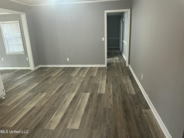 558 Daniel Cir, Jackson, MS 39212 - spare room featuring dark wood-type flooring, baseboards, and crown molding