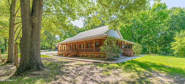 4005 Warriors Trl, Vicksburg, MS 39180 - view of side of home featuring covered porch, a lawn, and stairs