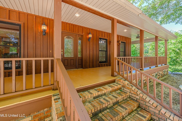 4005 Warriors Trl, Vicksburg, MS 39180 - property entrance with covered porch, board and batten siding, and a ceiling fan