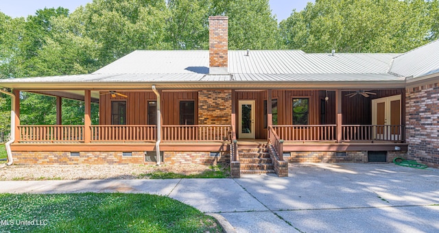 4005 Warriors Trl, Vicksburg, MS 39180 - view of front of home featuring crawl space, a ceiling fan, covered porch, a chimney, and metal roof