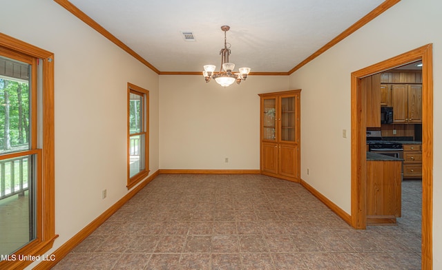 4005 Warriors Trl, Vicksburg, MS 39180 - empty room featuring crown molding, a chandelier, and baseboards
