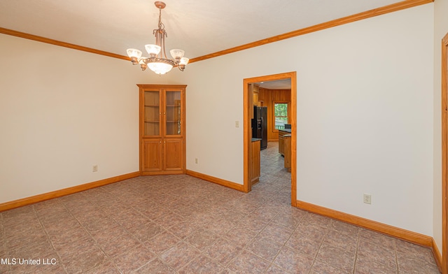 4005 Warriors Trl, Vicksburg, MS 39180 - spare room with ornamental molding, baseboards, and a chandelier
