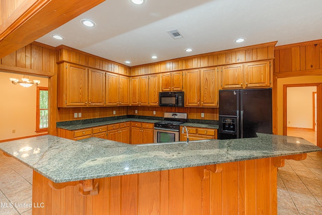 4005 Warriors Trl, Vicksburg, MS 39180 - kitchen with black appliances, light tile patterned flooring, brown cabinets, a kitchen breakfast bar, and recessed lighting