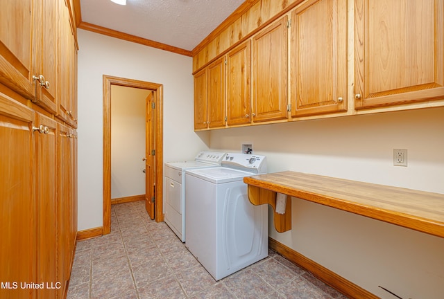 4005 Warriors Trl, Vicksburg, MS 39180 - washroom featuring separate washer and dryer, cabinet space, ornamental molding, baseboards, and a textured ceiling