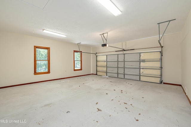 4005 Warriors Trl, Vicksburg, MS 39180 - garage featuring a garage door opener and baseboards