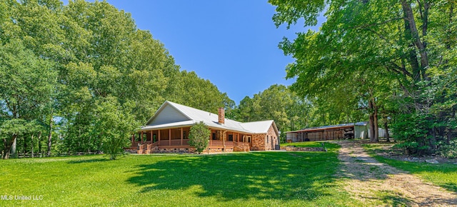 4005 Warriors Trl, Vicksburg, MS 39180 - view of grassy yard with a porch and dirt driveway