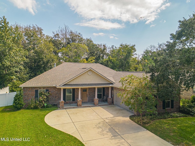 view of front of house featuring a front lawn and a garage