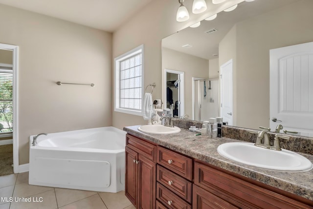 bathroom featuring vanity, shower with separate bathtub, tile patterned flooring, and a wealth of natural light