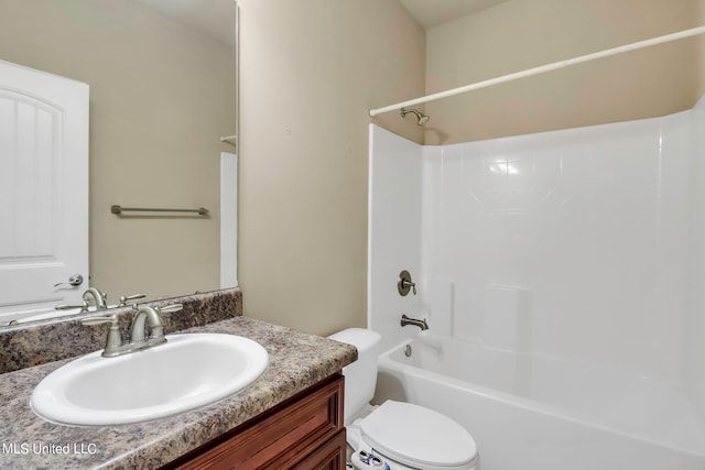 full bathroom featuring vanity, shower / washtub combination, and toilet