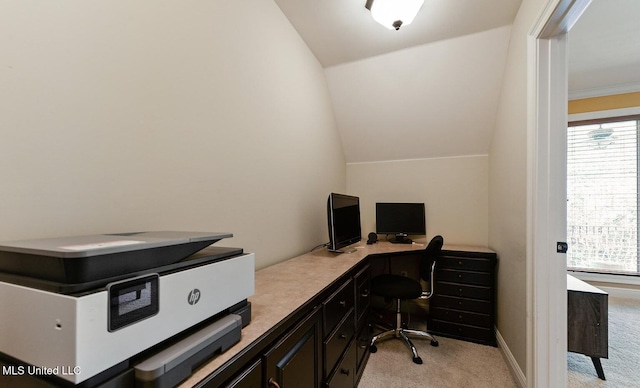 carpeted office with vaulted ceiling