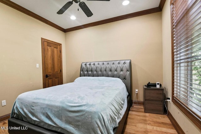 bedroom with ornamental molding, light hardwood / wood-style floors, and ceiling fan