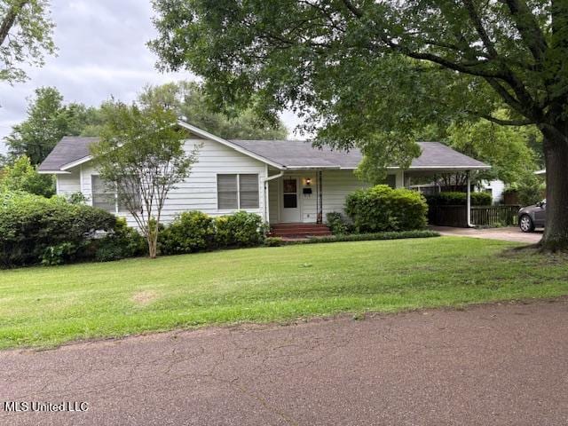 516 Parsons Ave, Greenwood, MS 38930 - ranch-style home with an attached carport, a front yard, and concrete driveway