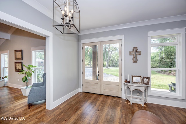 entryway with french doors, baseboards, dark wood-type flooring, and a notable chandelier