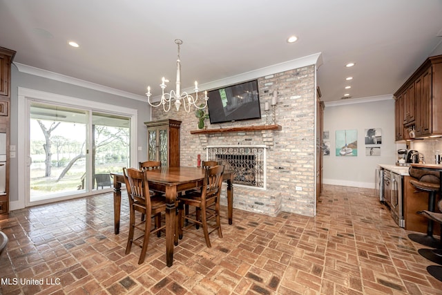 dining area featuring baseboards, brick floor, a fireplace, and recessed lighting