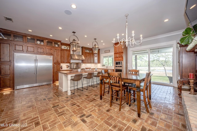 dining room with brick floor, a notable chandelier, recessed lighting, and visible vents