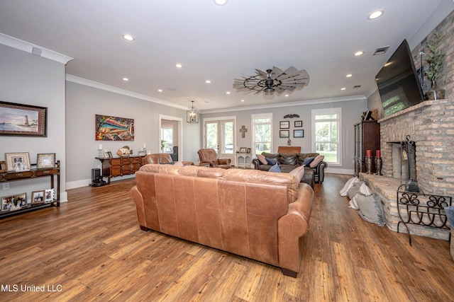 living room featuring recessed lighting, wood finished floors, and visible vents
