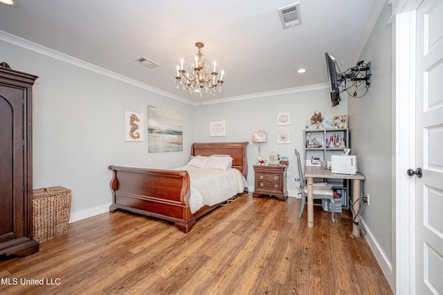 bedroom featuring visible vents, wood finished floors, and an inviting chandelier