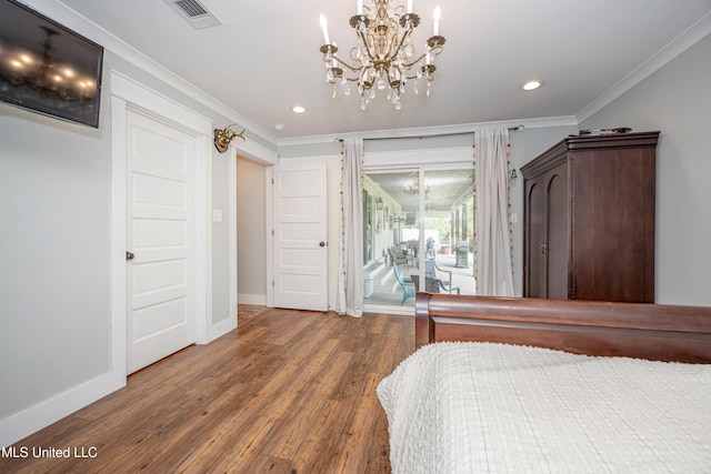 bedroom featuring visible vents, access to exterior, wood finished floors, and a notable chandelier