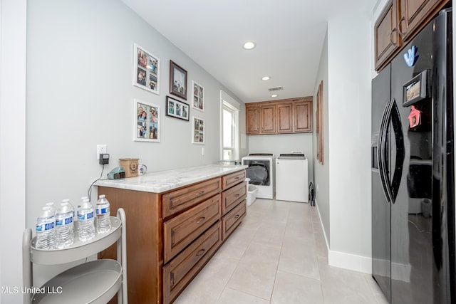 bathroom featuring washer and dryer, toilet, baseboards, recessed lighting, and tile patterned floors