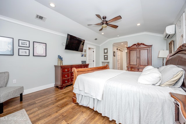 bedroom with visible vents, crown molding, wood finished floors, a wall mounted air conditioner, and recessed lighting