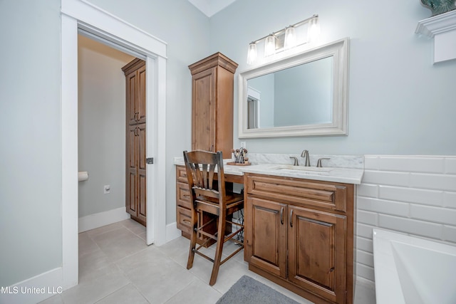 full bathroom with tile patterned floors, baseboards, and vanity