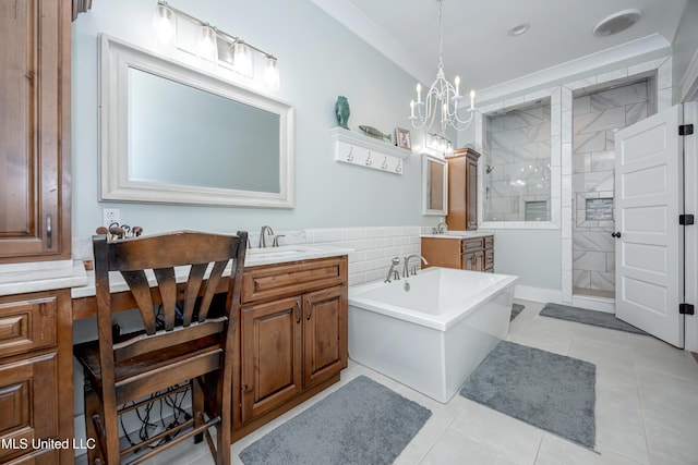 bathroom with an inviting chandelier, walk in shower, tile patterned floors, and a soaking tub