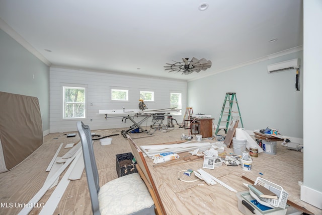 dining space featuring baseboards, ornamental molding, a wall unit AC, and a wealth of natural light
