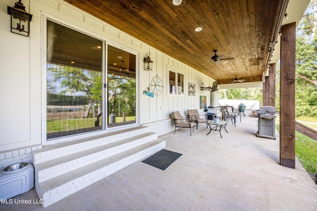 view of patio featuring area for grilling, a ceiling fan, and entry steps