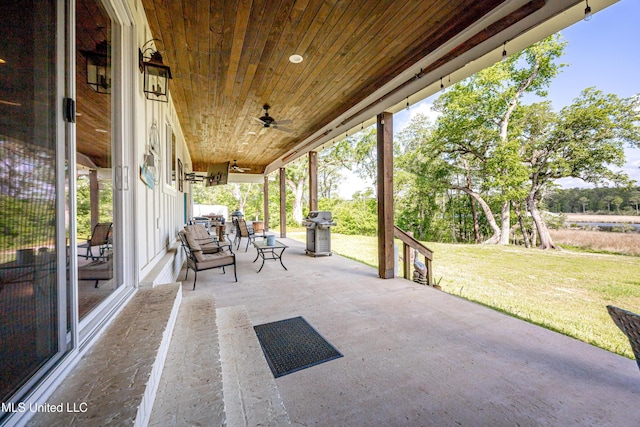 view of patio with a ceiling fan and a grill