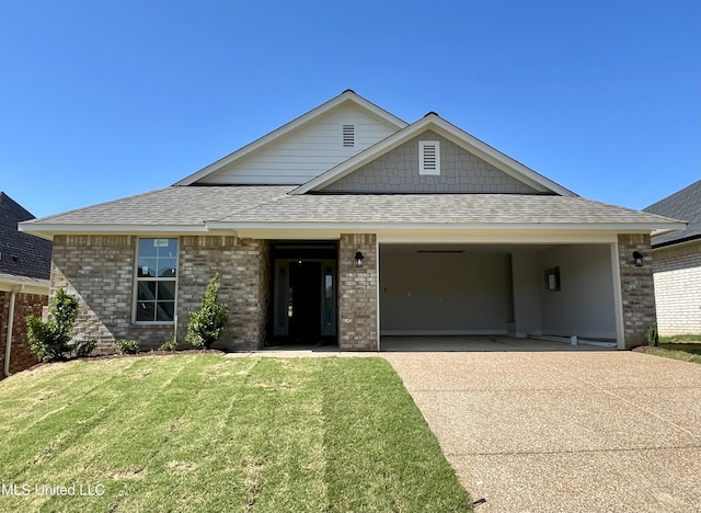 1562 Cambria Dr, Southaven, MS 38671 - view of front of property featuring concrete driveway, a shingled roof, a garage, a front lawn, and brick siding