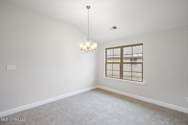 spare room featuring carpet flooring, lofted ceiling, and an inviting chandelier