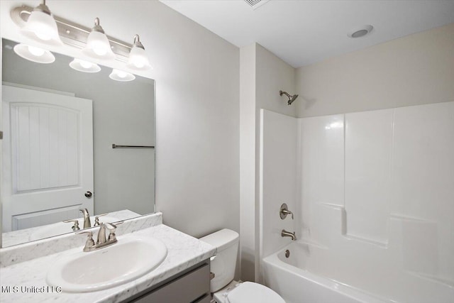 full bathroom with toilet, vanity, and  shower combination