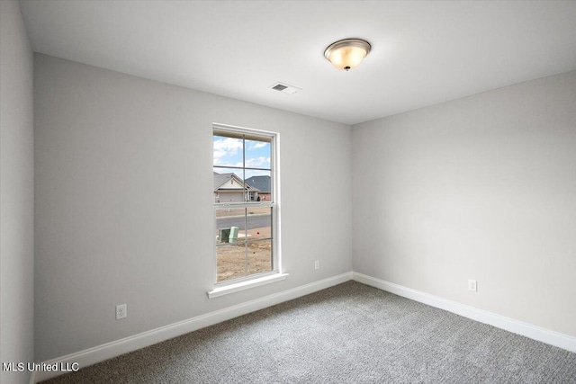 unfurnished room featuring carpet