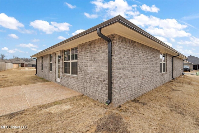 view of side of property featuring a patio