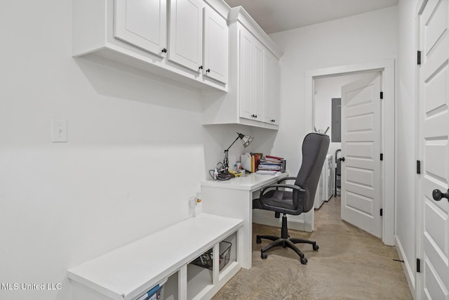 office area with concrete floors