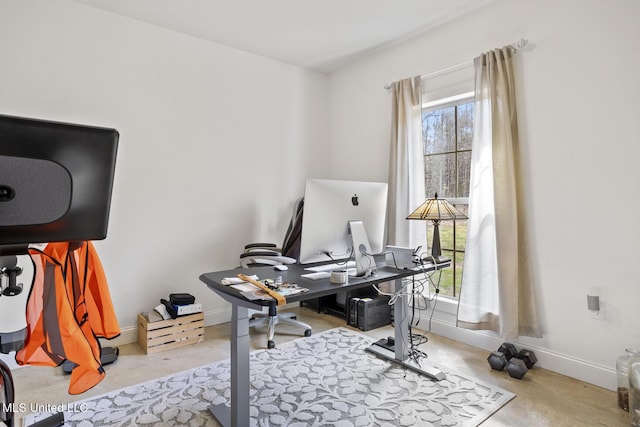 office with plenty of natural light and baseboards