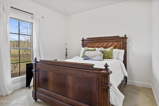 bedroom featuring baseboards