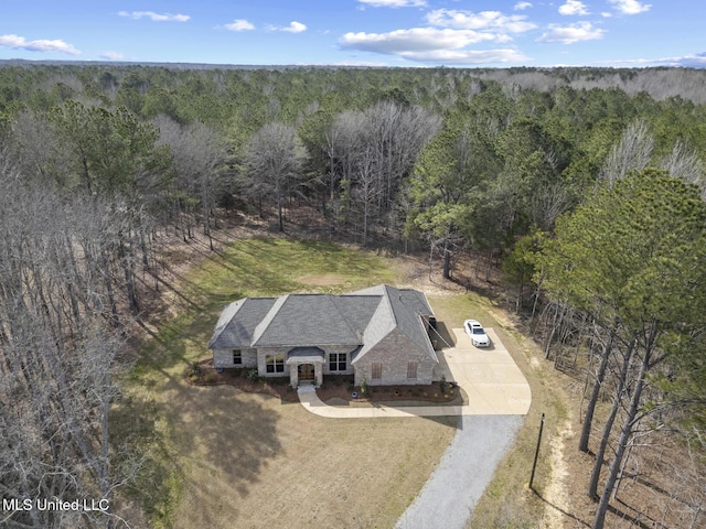 drone / aerial view with a view of trees