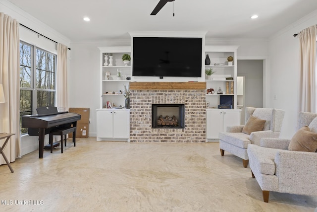 living area with recessed lighting, a fireplace, crown molding, and ceiling fan