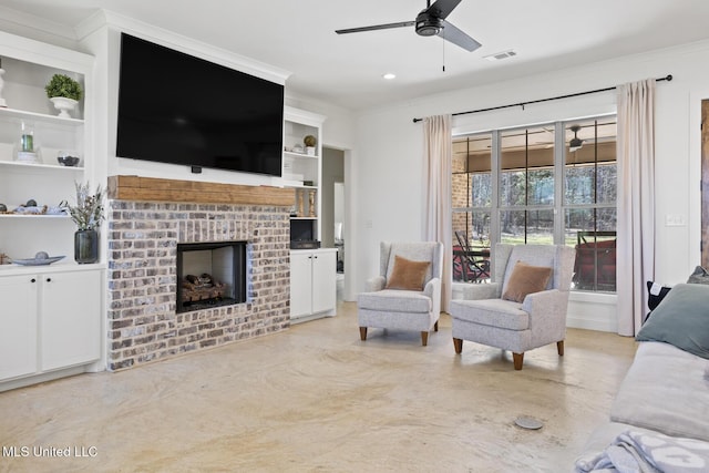 living room featuring built in shelves, a fireplace, visible vents, and crown molding