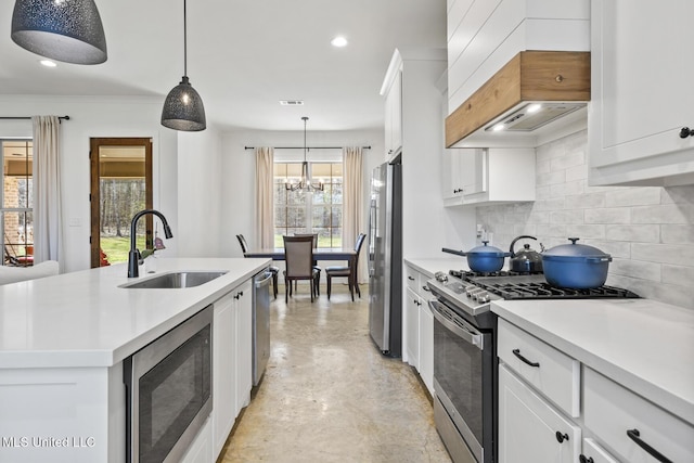 kitchen with a sink, white cabinets, light countertops, appliances with stainless steel finishes, and tasteful backsplash