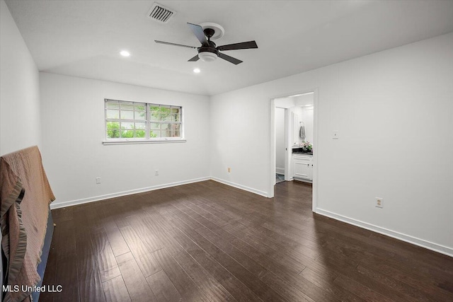 unfurnished bedroom featuring dark hardwood / wood-style floors and ceiling fan