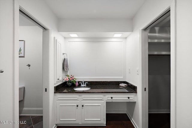 bathroom with vanity, toilet, and tile patterned flooring